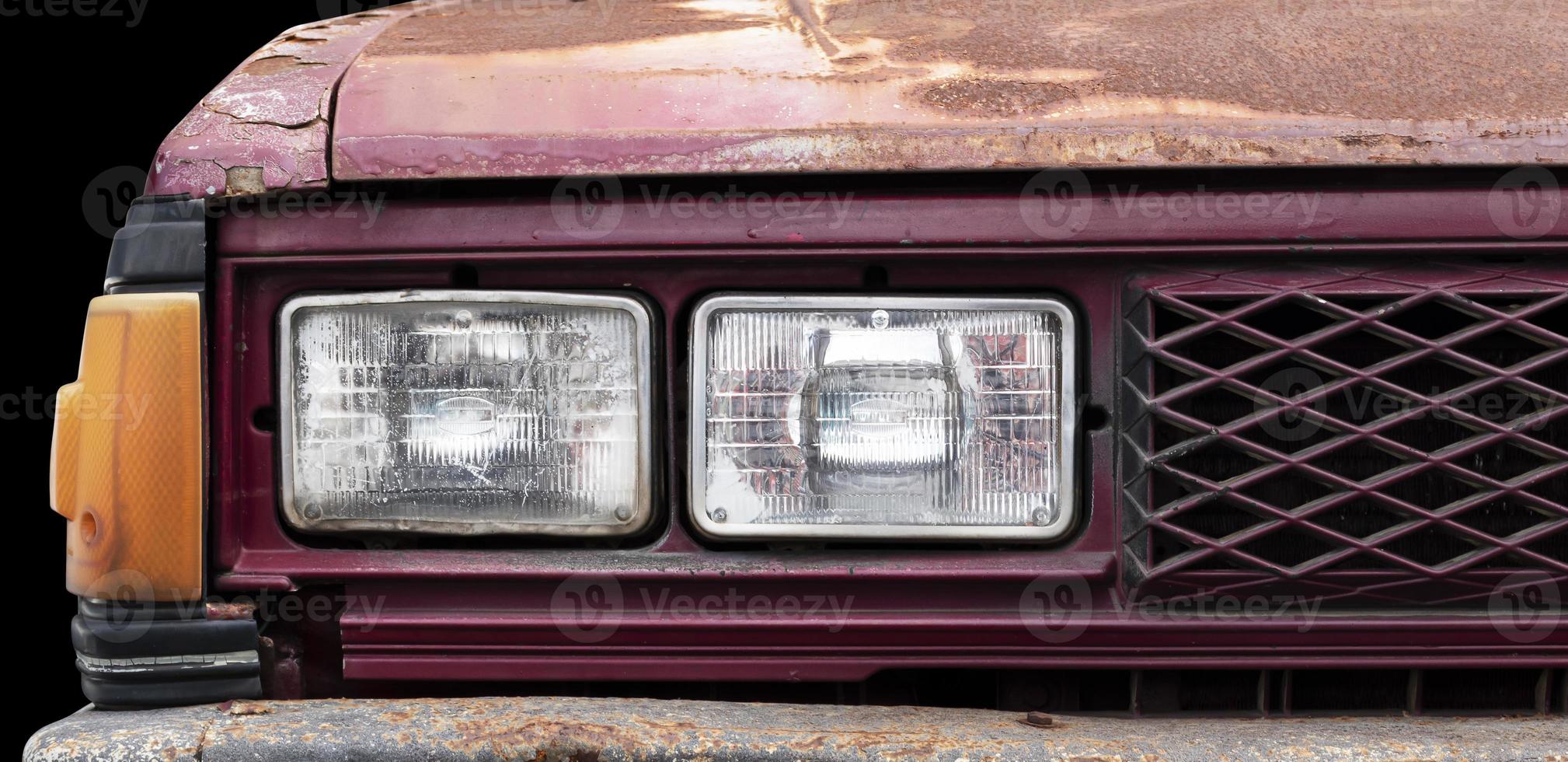 Front view close up headlamp retro car isolated on black blackground photo