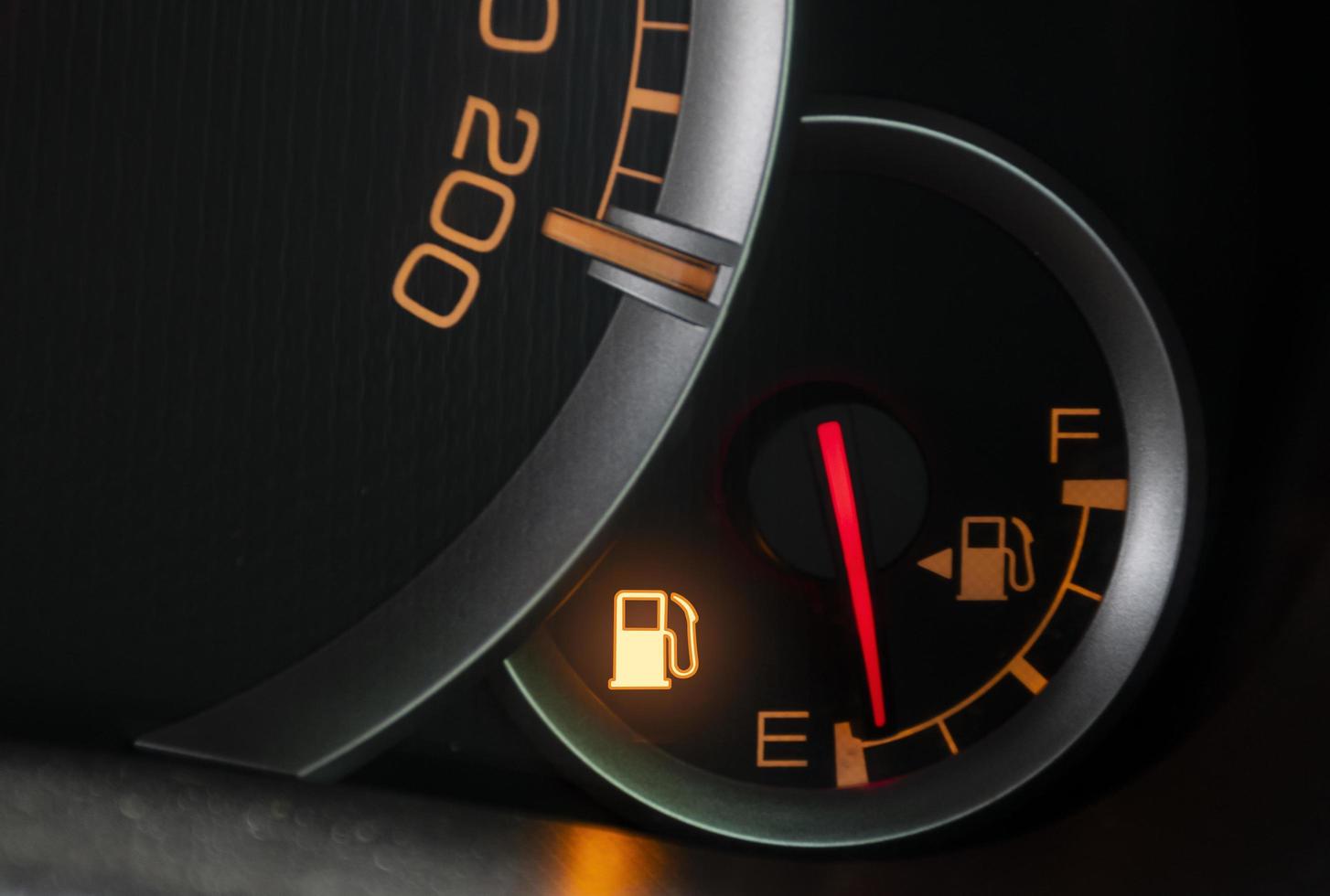 Oil level gauge show icon low fuel warning on car dashboard photo