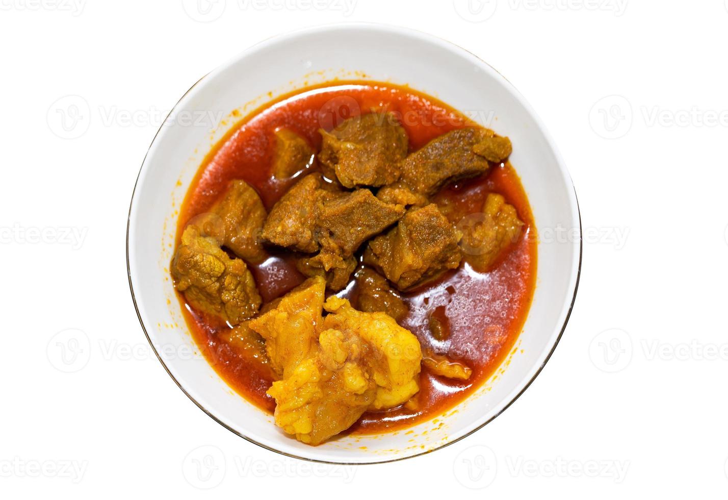 Beef or curry homemade recipe in a bowl with white background photo