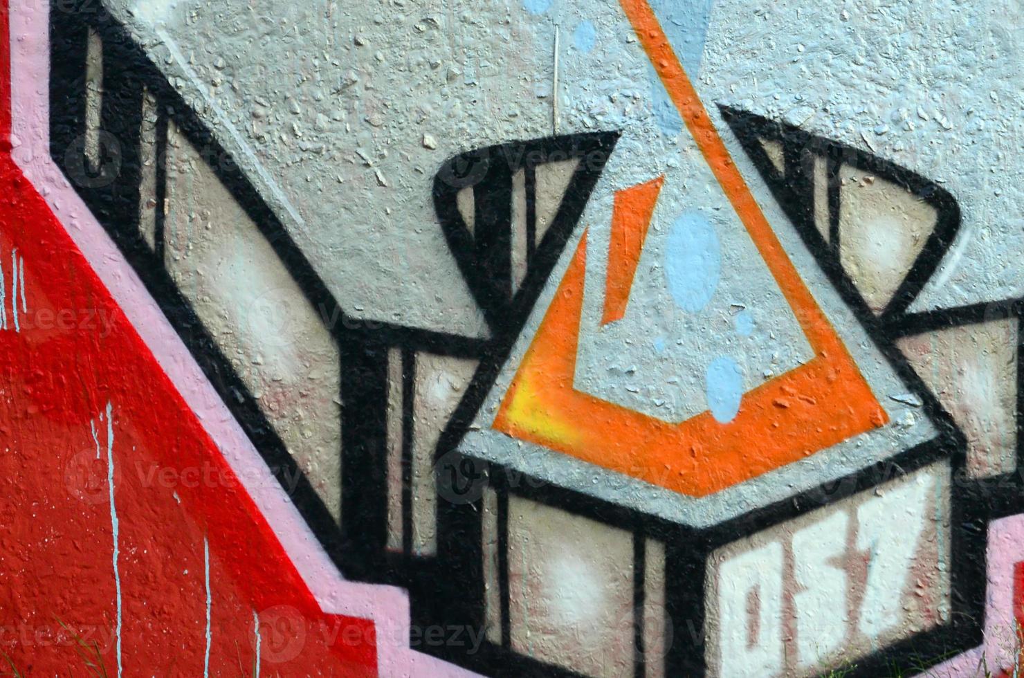 Fragment of graffiti drawings. The old wall decorated with paint stains in the style of street art culture. Colored background texture photo