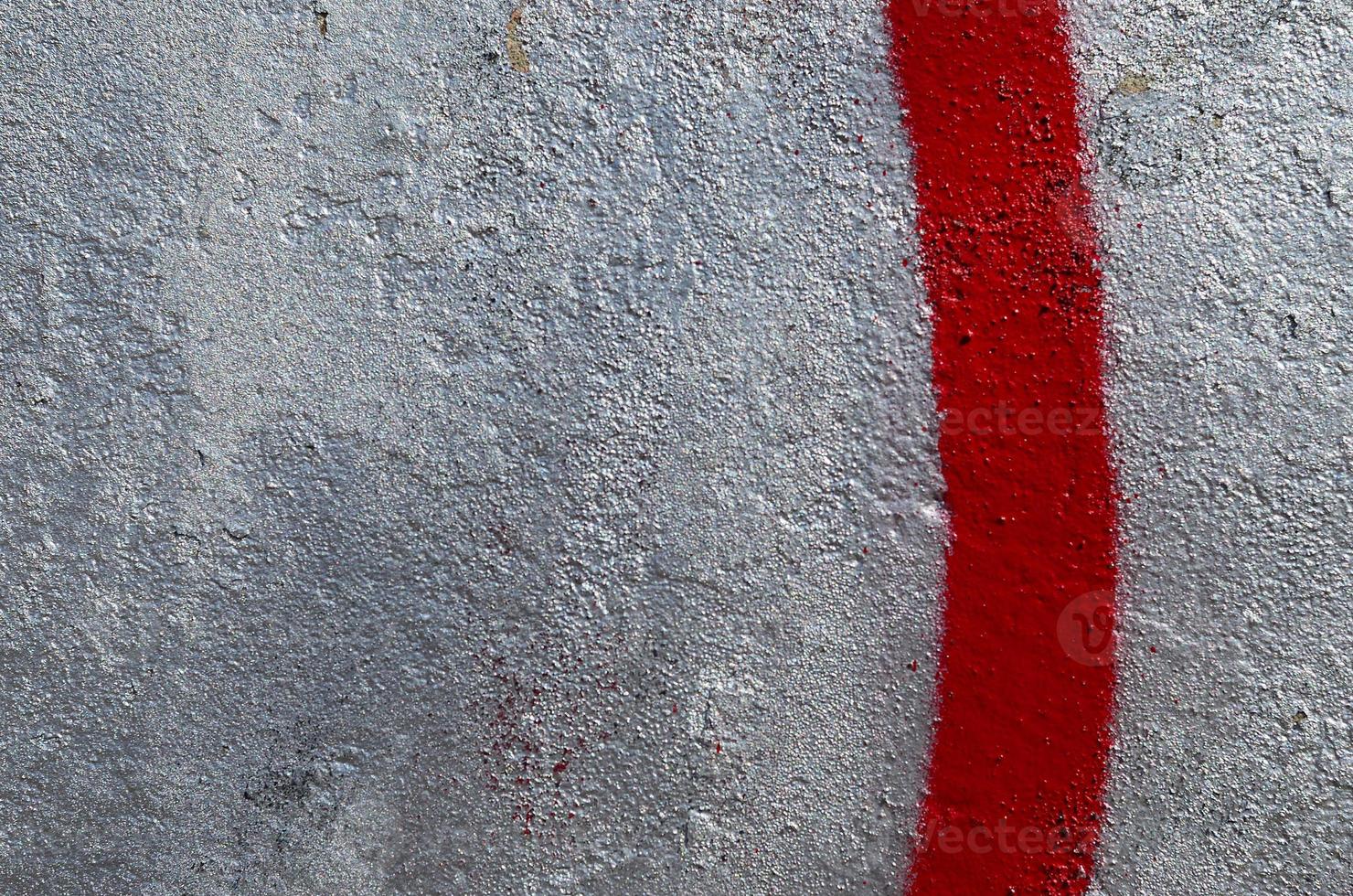 Fragment of graffiti drawings. The old wall decorated with paint stains in the style of street art culture. Colored background texture photo
