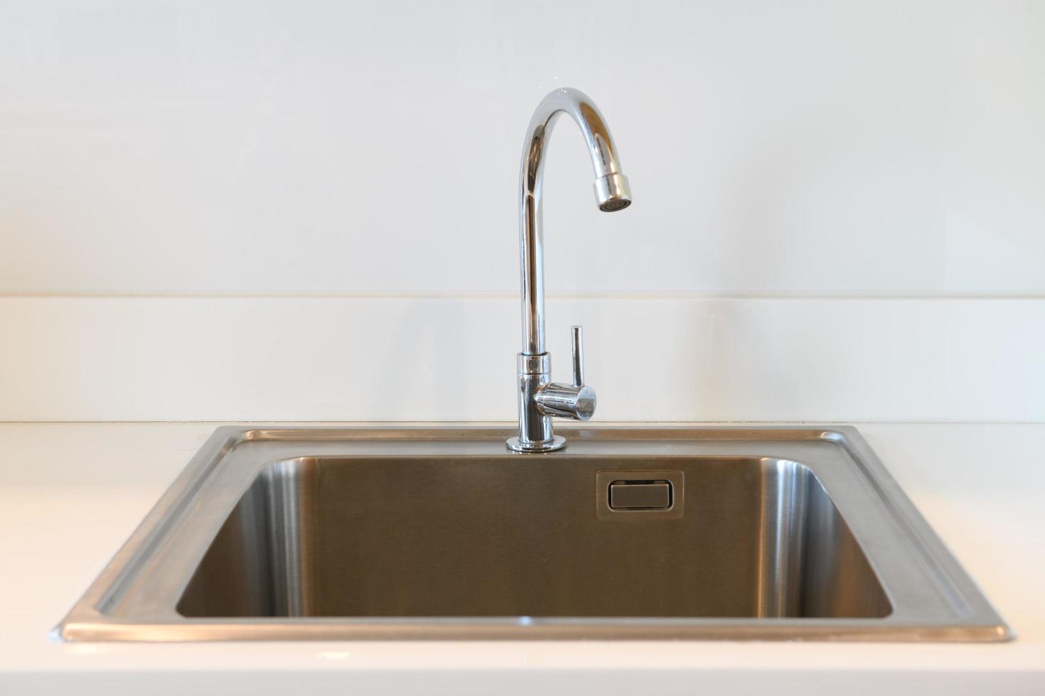 stainless steel kitchen sink in room photo