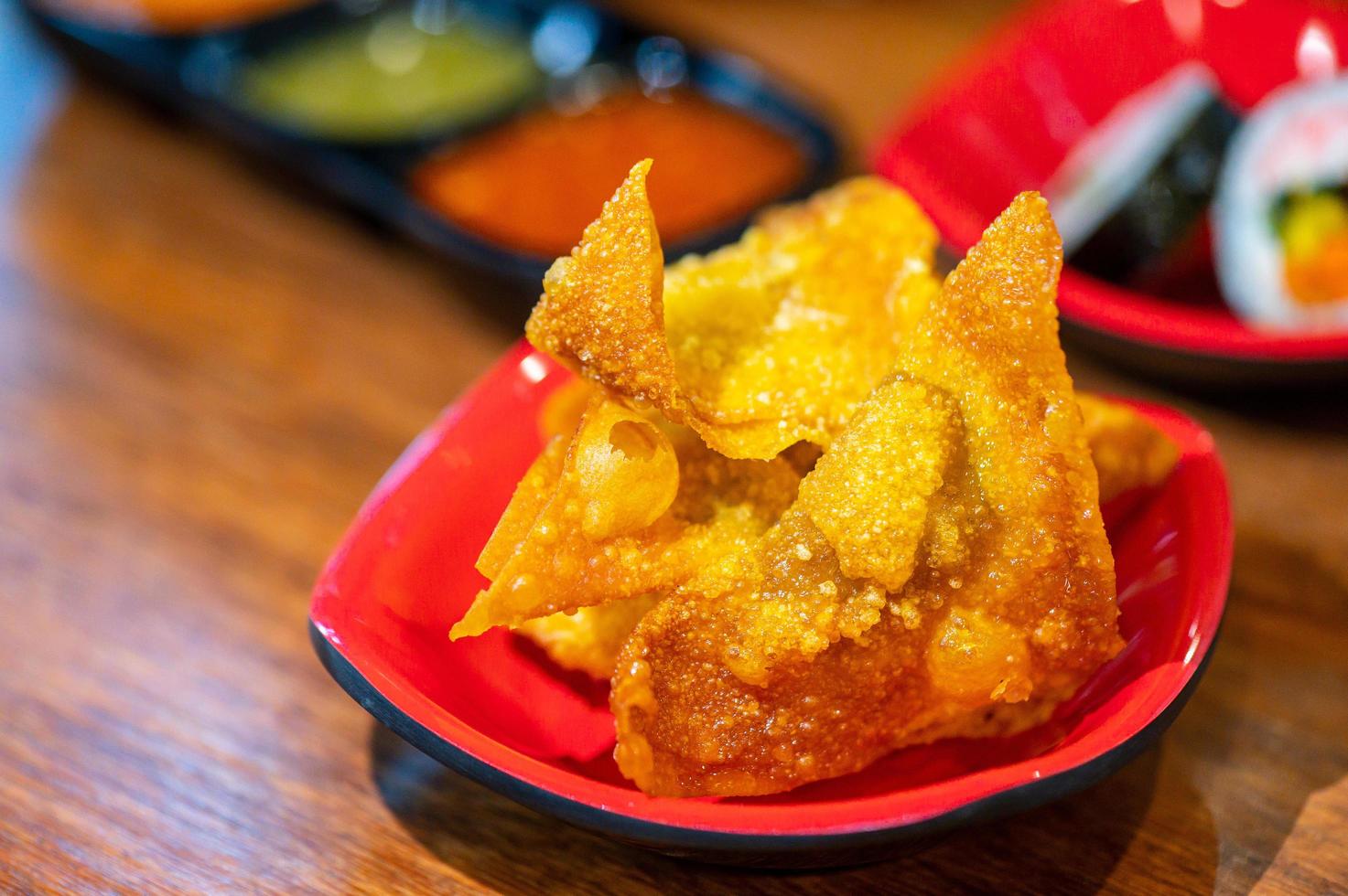 fried dumplings on red plate photo