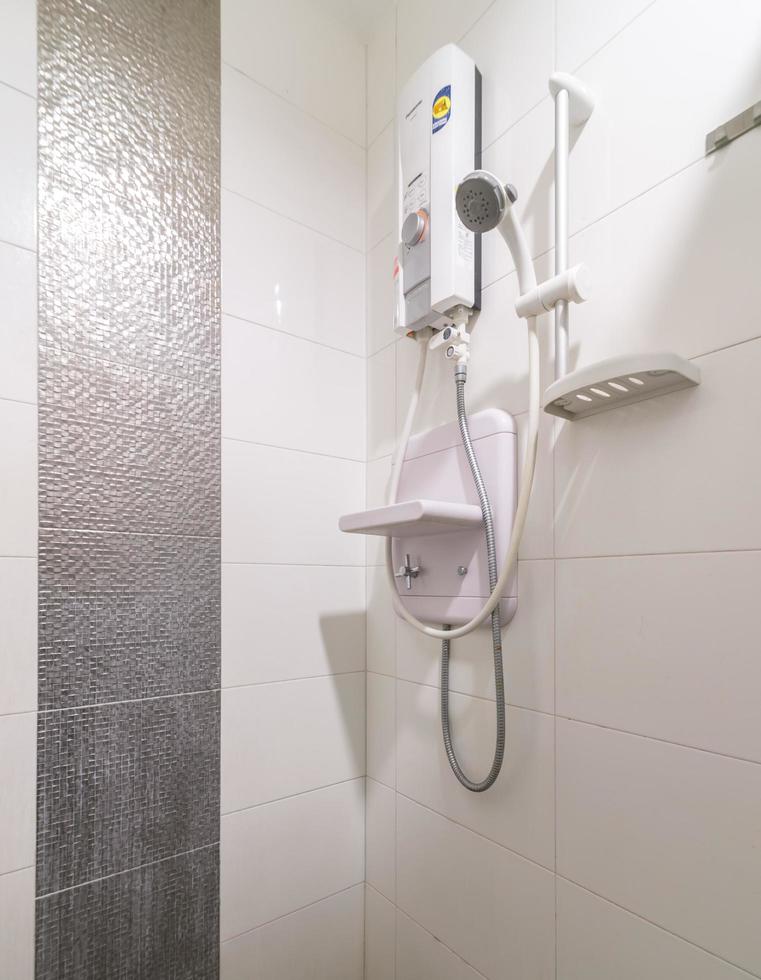 Loft white tile bathroom corner, tub and sink photo