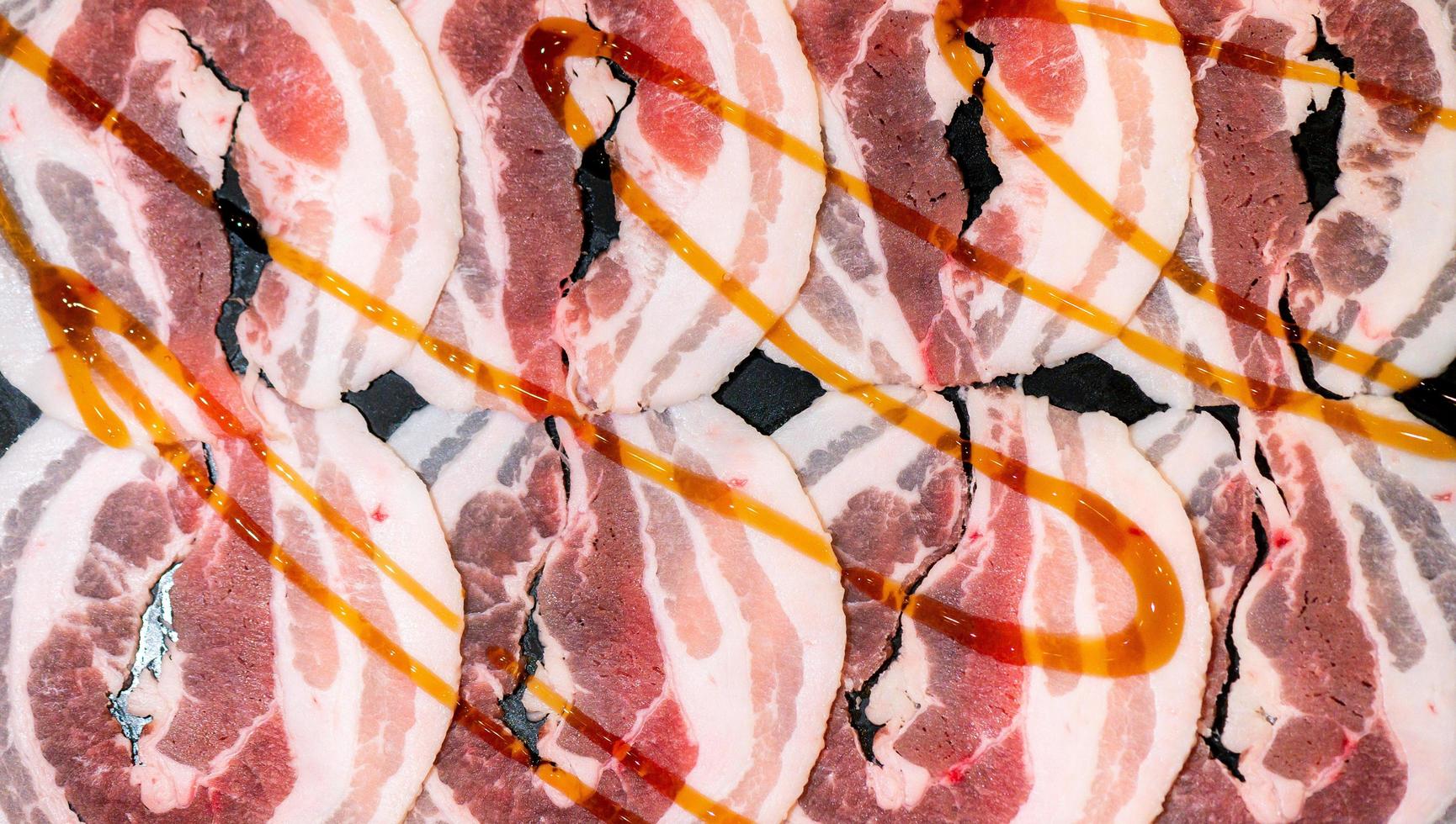 Slide raw beef for Yakiniku. Thin piece beef for Shabu hotpot japanese food style. Close up fresh meat chuck eye for Sukiyaki. top view photo