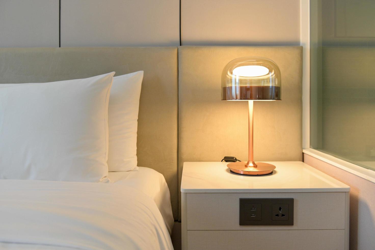 Elegant room interior with large comfortable bed photo