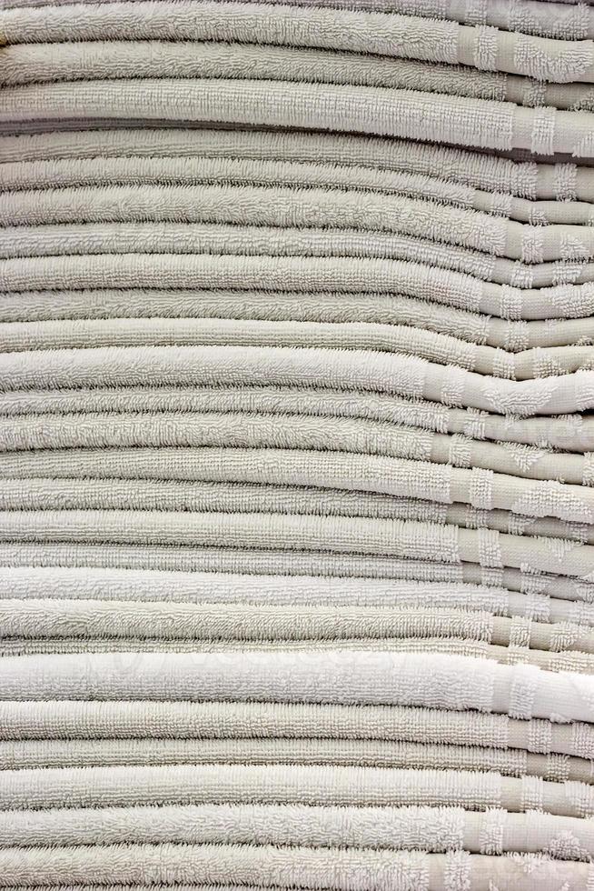 Clean towels. Many clean white towels are neatly stacked on. photo