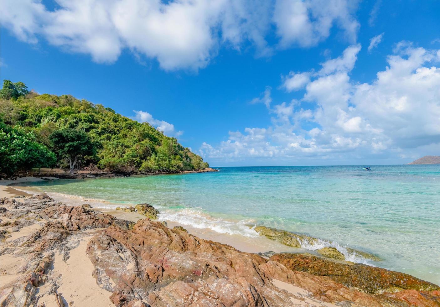 Sea waves on sand beach water and coast seascape rocky coast - View of beautiful tropical landscape beach sea island with ocean blue sky and resort background in Thailand summer beach vacation photo