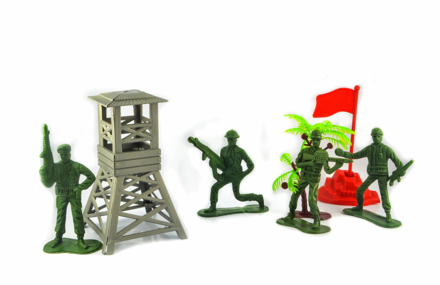 Group of Miniature hold gun toy soldier isolated on white background photo