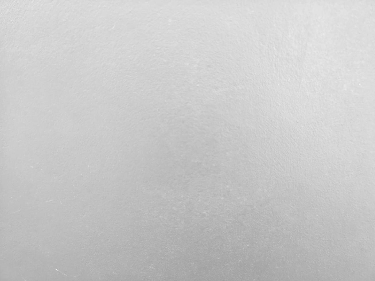 faded paint crack on cement wall bare polished grey color and smooth surface texture concrete material vintage background detail architect construction brick walls plastered and painted photo