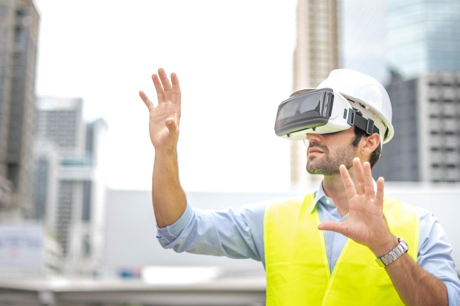 Caucasian man use VR glasses watching video for entertainment, work, free time and study. Virtual reality technology concept. photo