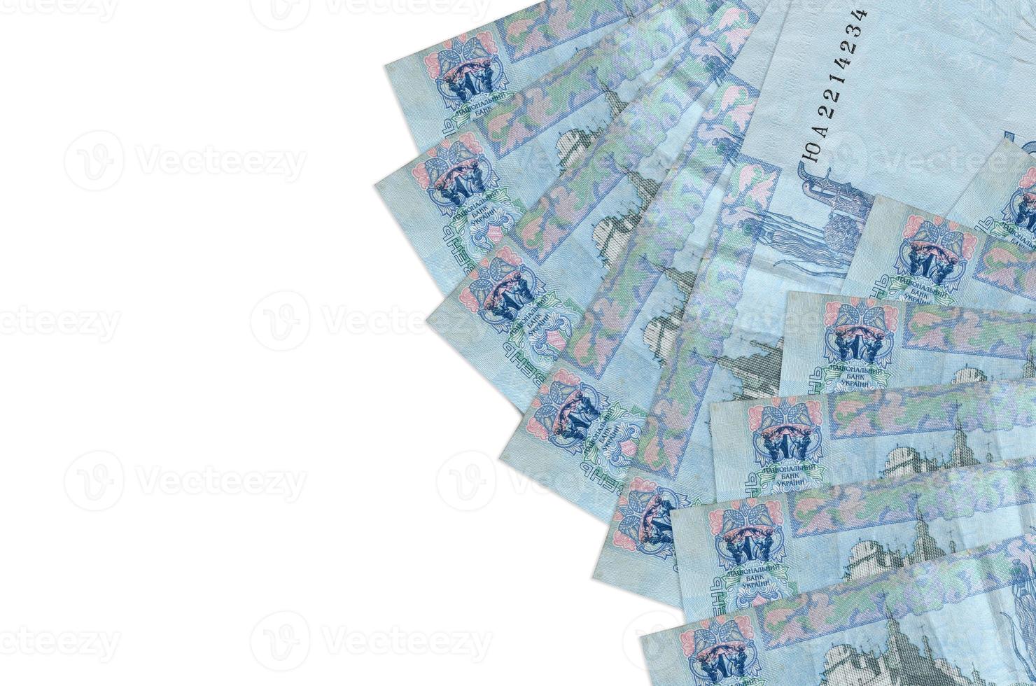 5 Ukrainian hryvnias bills lies isolated on white background with copy space. Rich life conceptual background photo