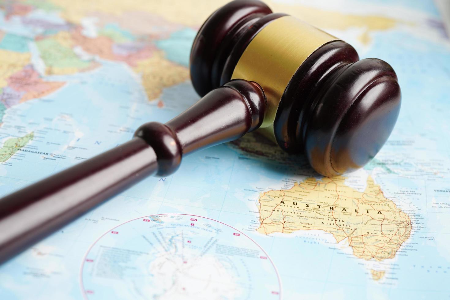 Bangkok, Thailand - May 15, 2022 Judges gavel on world map. photo