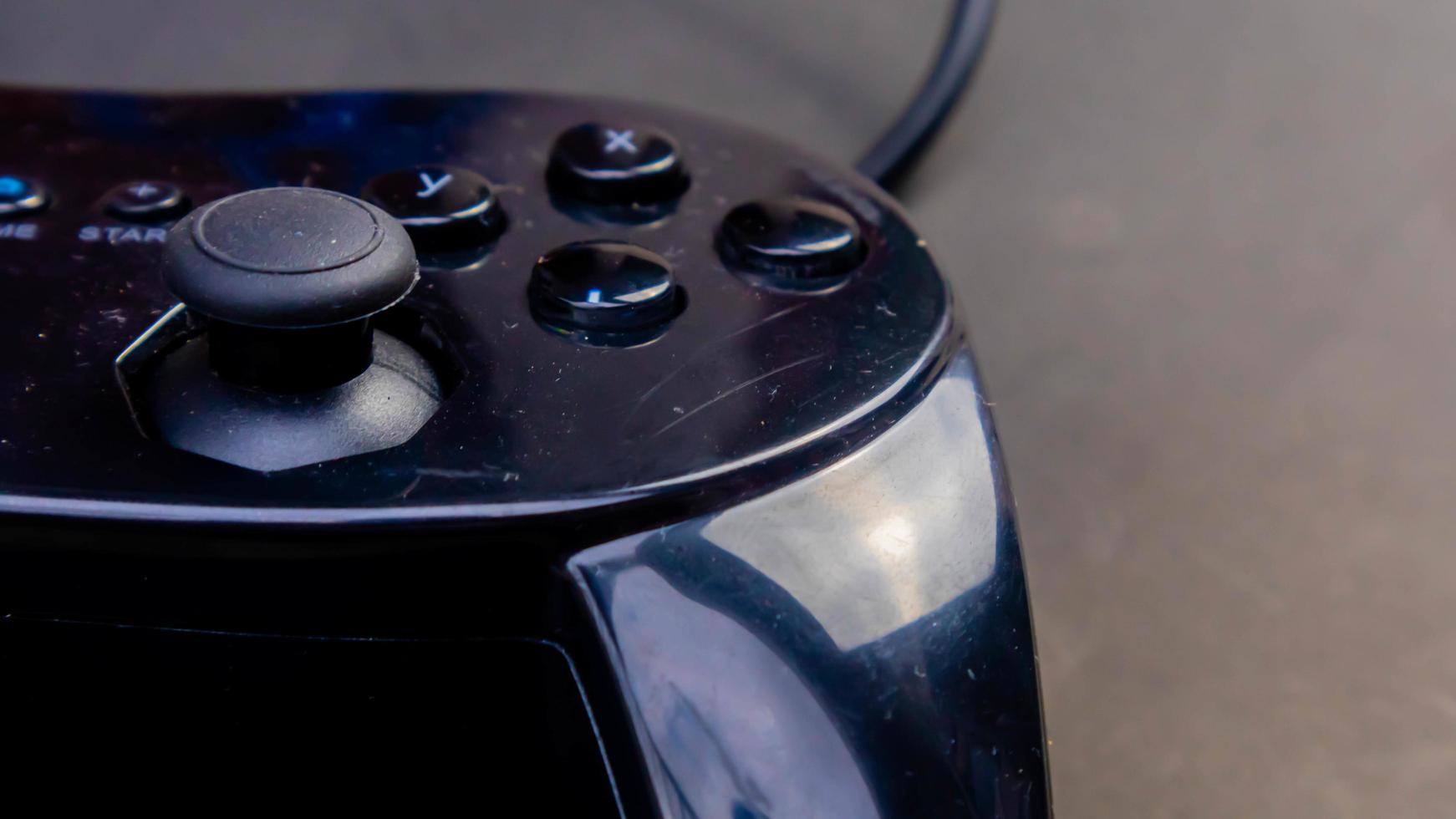 black joystick isolated black background photo