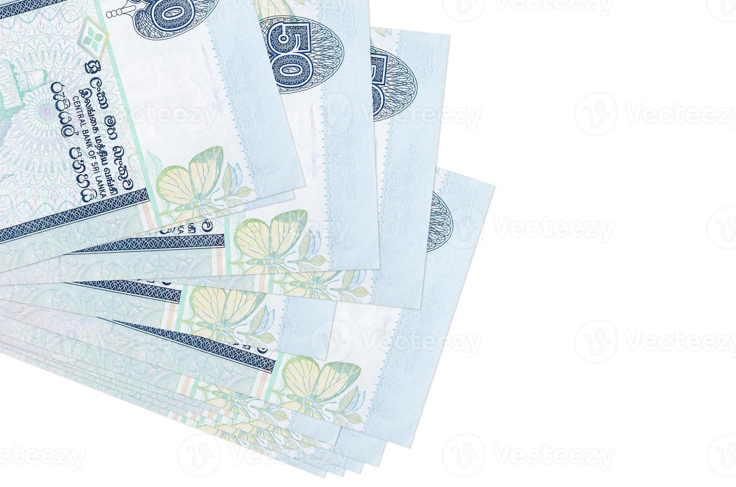 50 Sri Lankan rupees bills lies in small bunch or pack isolated on white. Mockup with copy space. Business and currency exchange photo