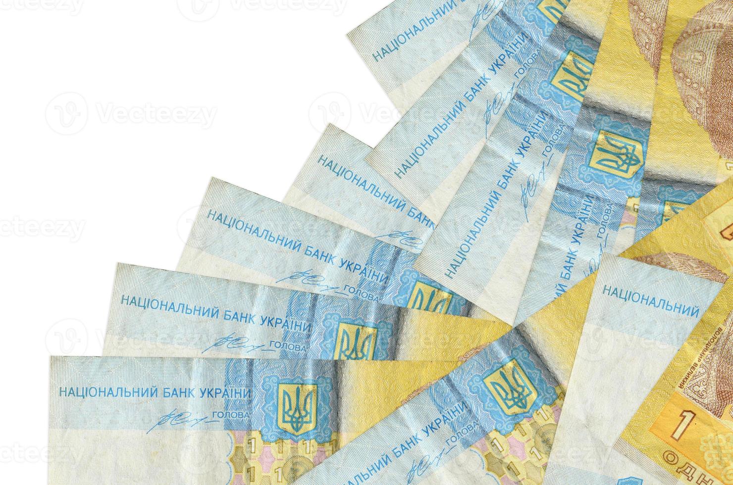 1 Ukrainian hryvnia bills lies in different order isolated on white. Local banking or money making concept photo