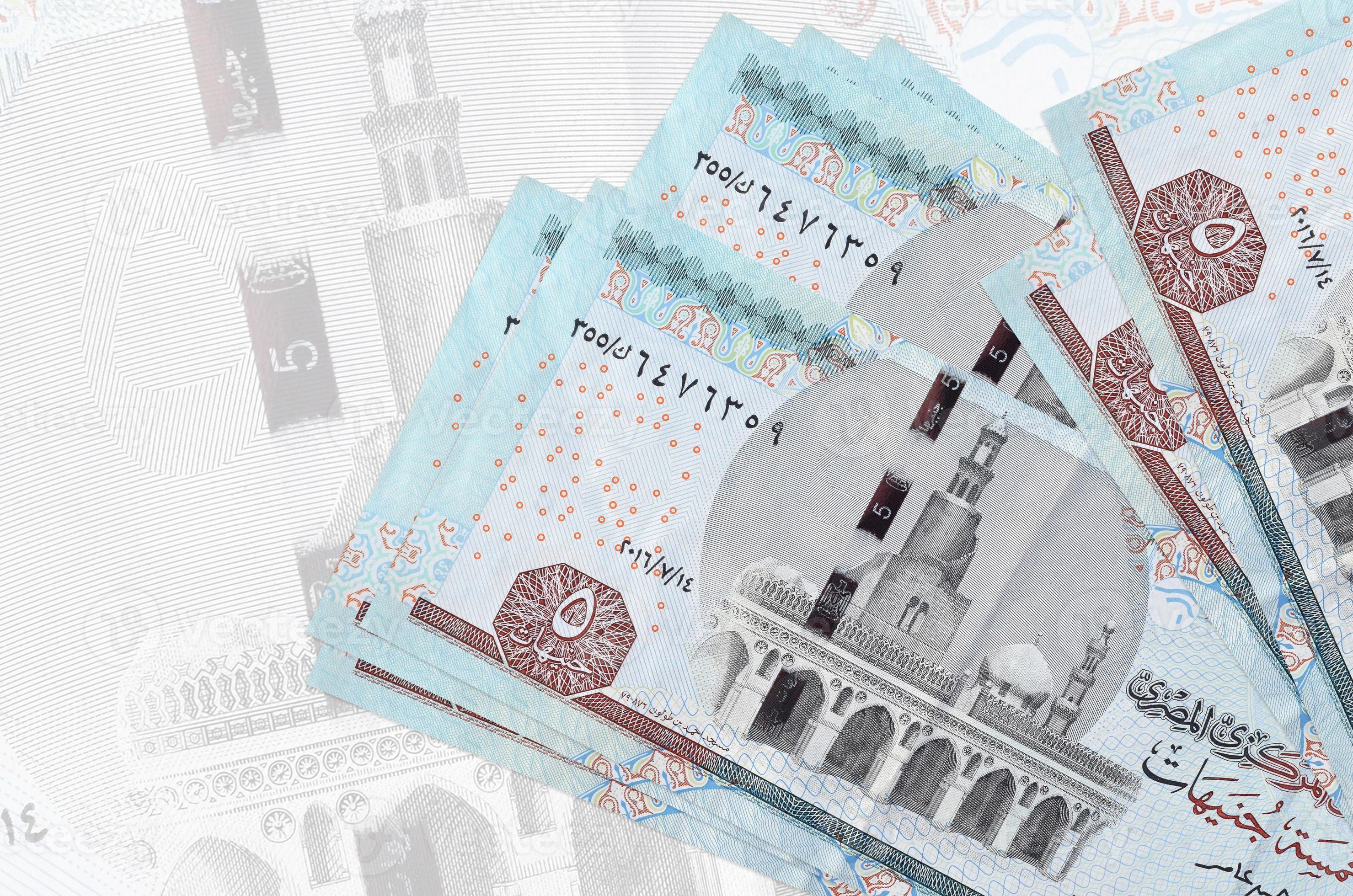5-egyptian-pounds-bills-lies-in-stack-on-background-of-big-semi