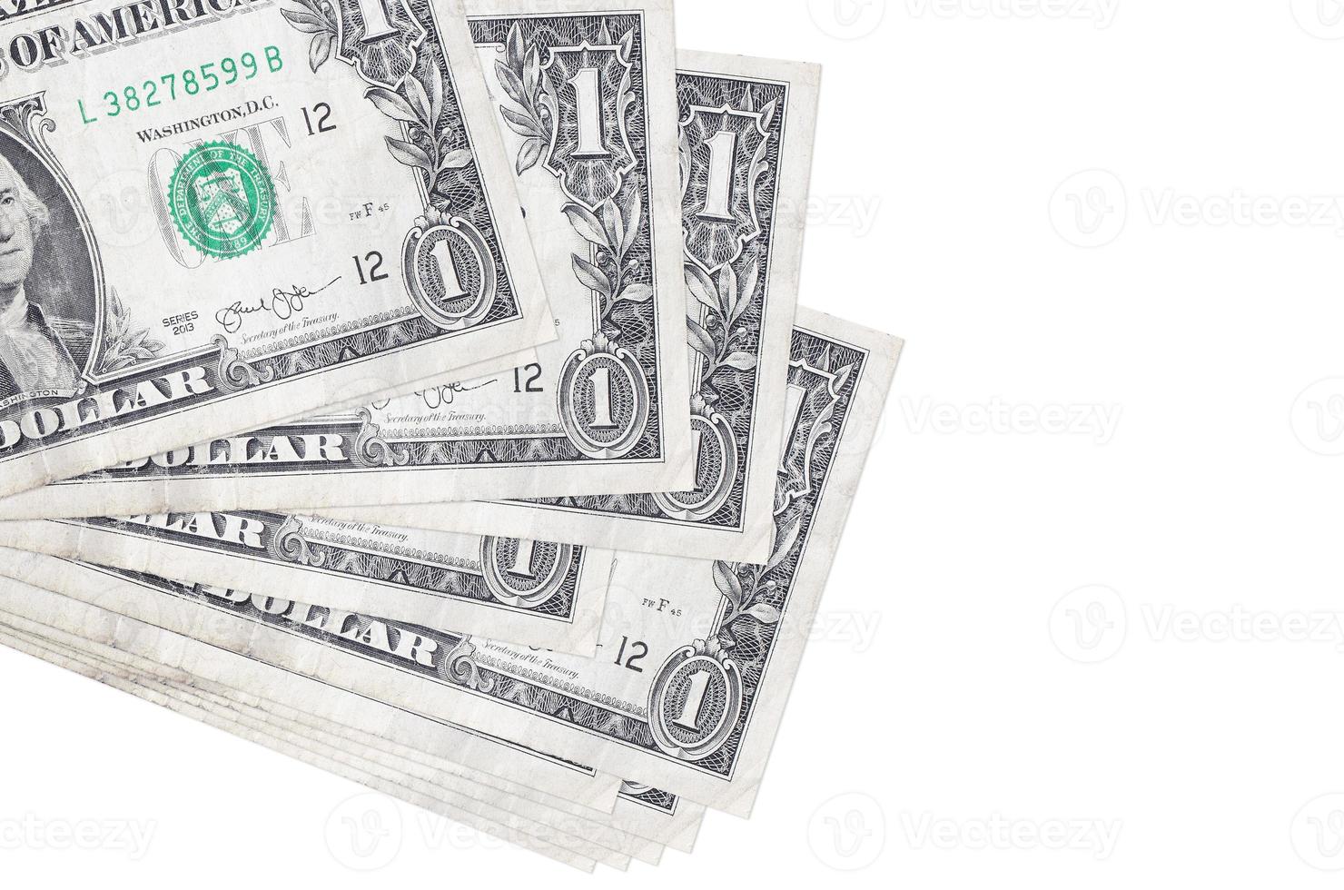 1 US dollar bills lies in small bunch or pack isolated on white. Mockup with copy space. Business and currency exchange photo