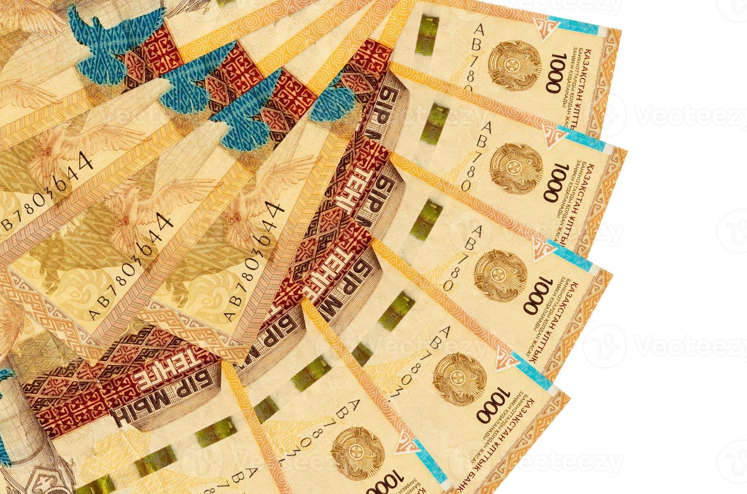 1000 Kazakhstani tenge bills lies isolated on white background with copy space stacked in fan shape close up photo
