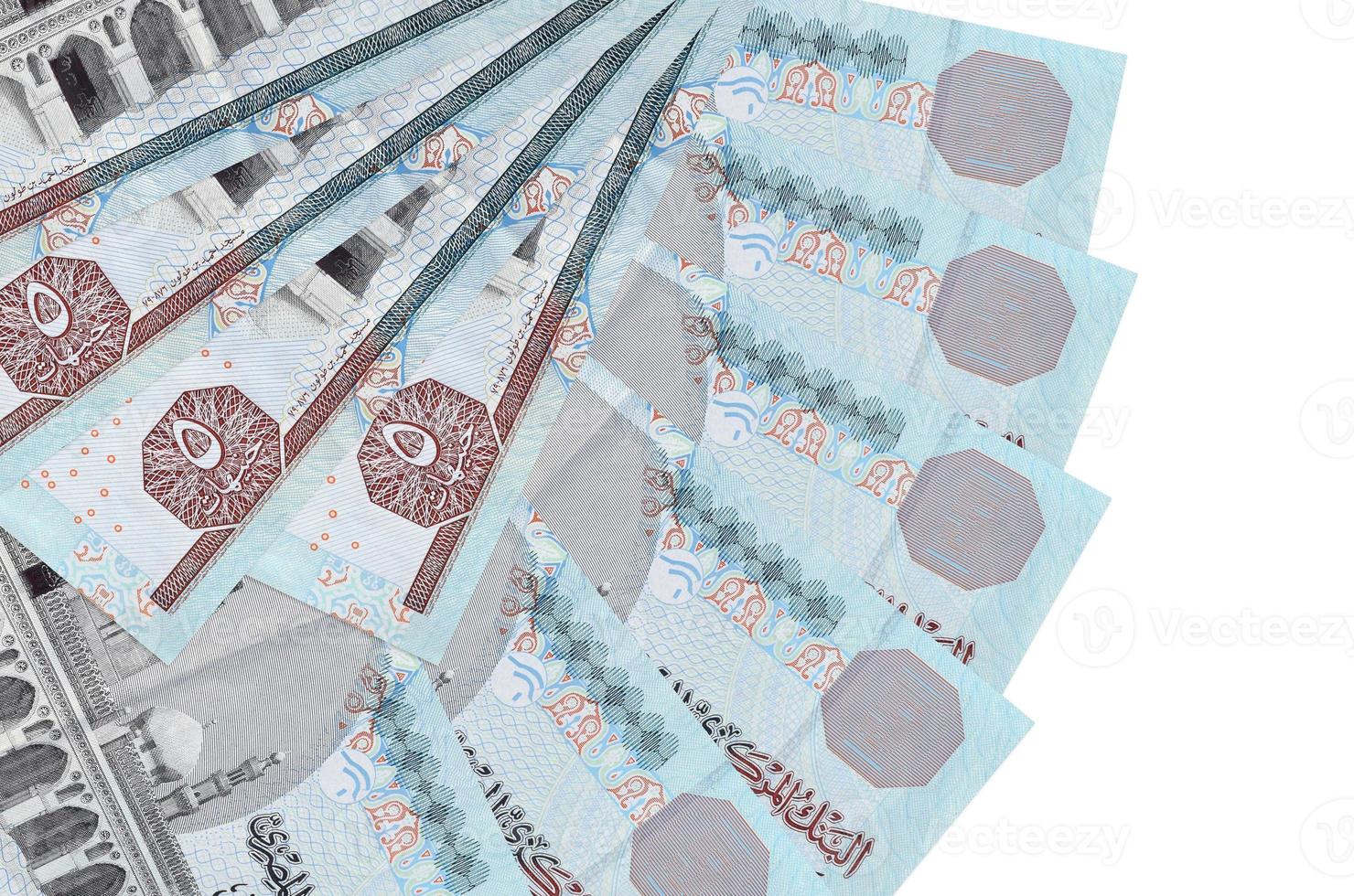 5 Egyptian pounds bills lies isolated on white background with copy space stacked in fan shape close up photo
