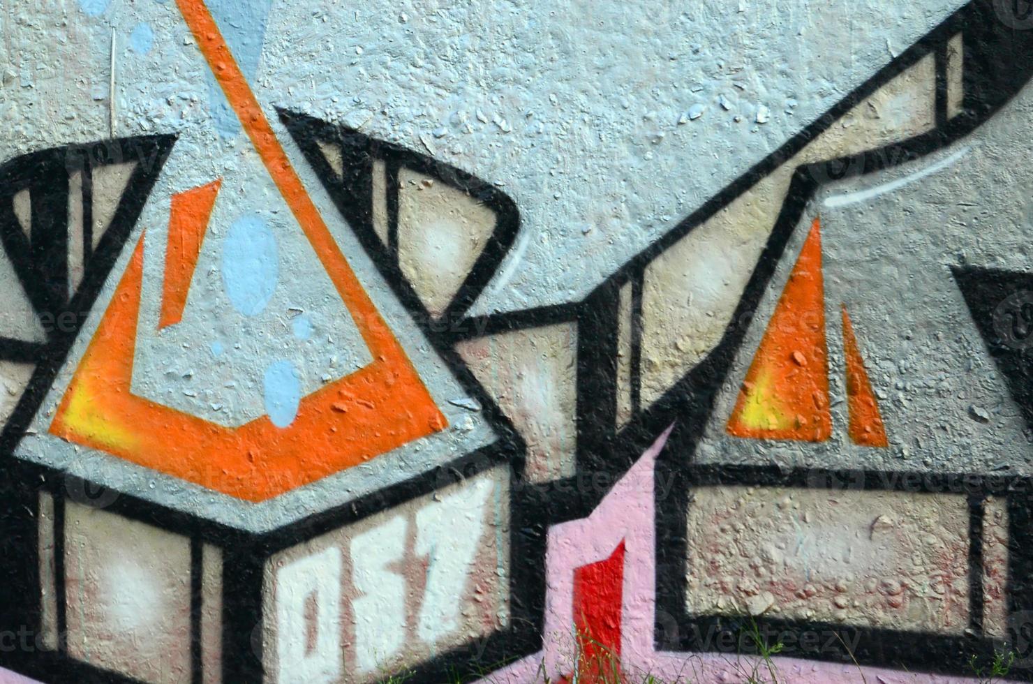 Fragment of graffiti drawings. The old wall decorated with paint stains in the style of street art culture. Colored background texture photo