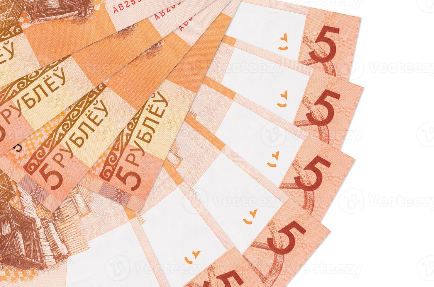 5 Belorussian rubles bills lies isolated on white background with copy space stacked in fan shape close up photo