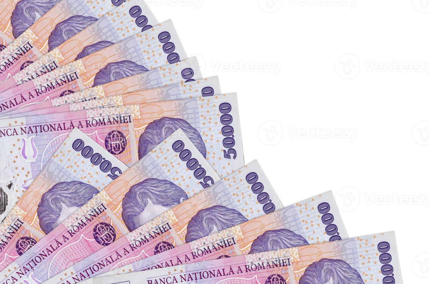 50000 Romanian leu bills lies isolated on white background with copy space stacked in fan close up photo