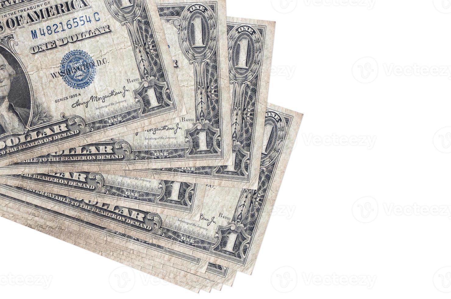 1 US dollar bills lies in small bunch or pack isolated on white. Mockup with copy space. Business and currency exchange photo