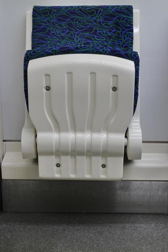 subway folding passenger seat close-up photo