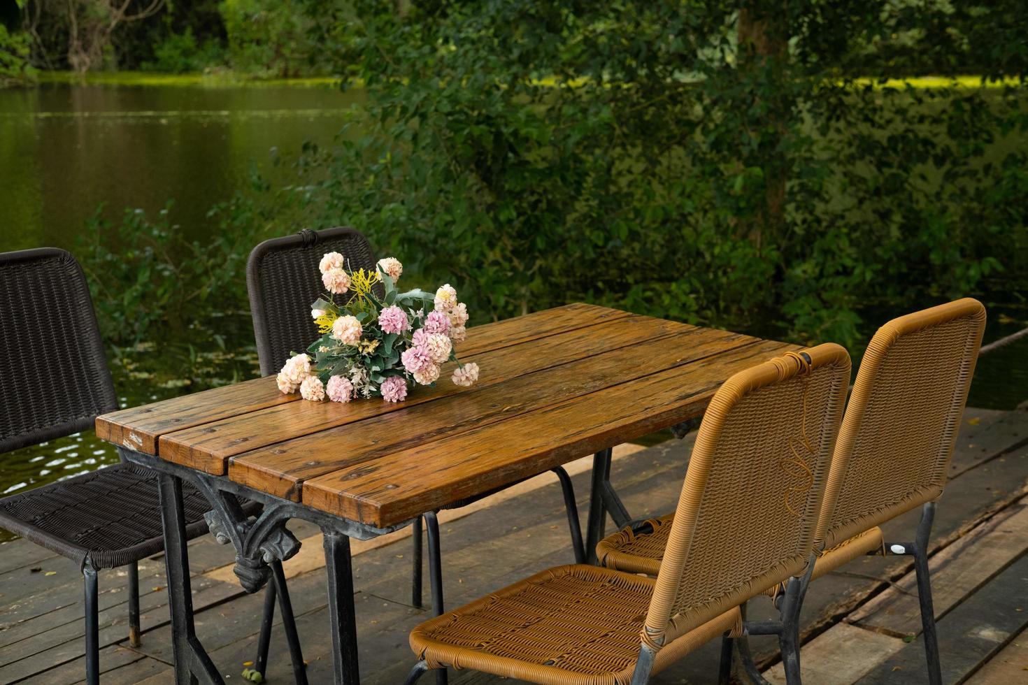Set of tables and chairs in a peaceful garden For sitting, relaxing, eating, drinking coffee. photo