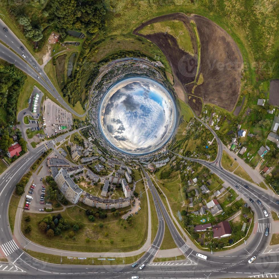 blue sphere inside overlooking old town, urban development, historic buildings and crossroads with cars. Transformation of spherical 360 panorama in abstract aerial view. photo