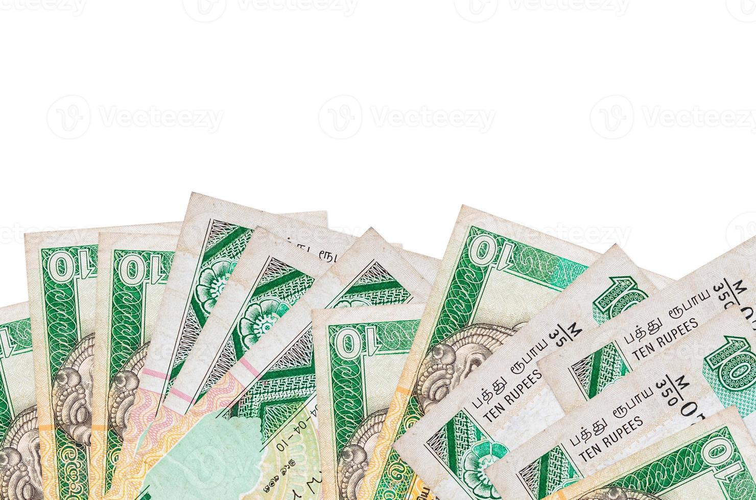 10 Sri Lankan rupees bills lies on bottom side of screen isolated on white background with copy space. Background banner template photo