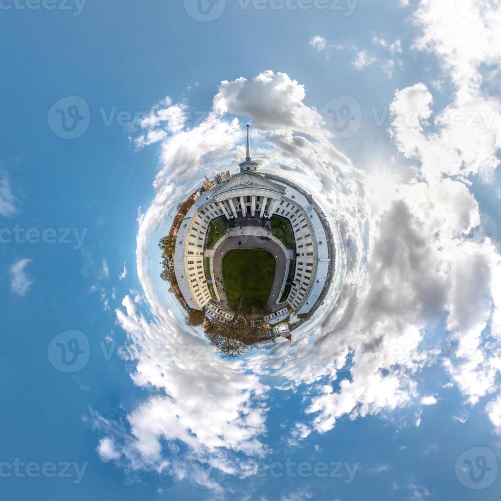 little planet and spherical aerial 360 panorama view on street ancient medieval castle with church and historic buildings with columns photo