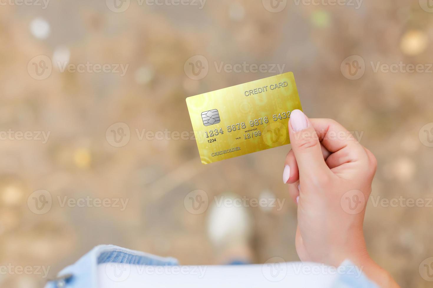 Hand holding credit card photo