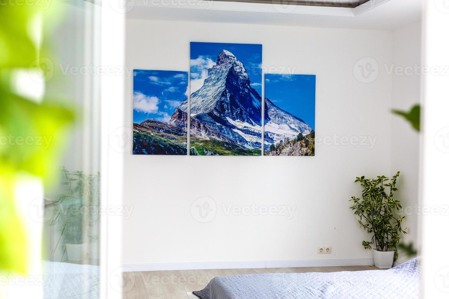 the picture hangs on the wall in the bedroom photo