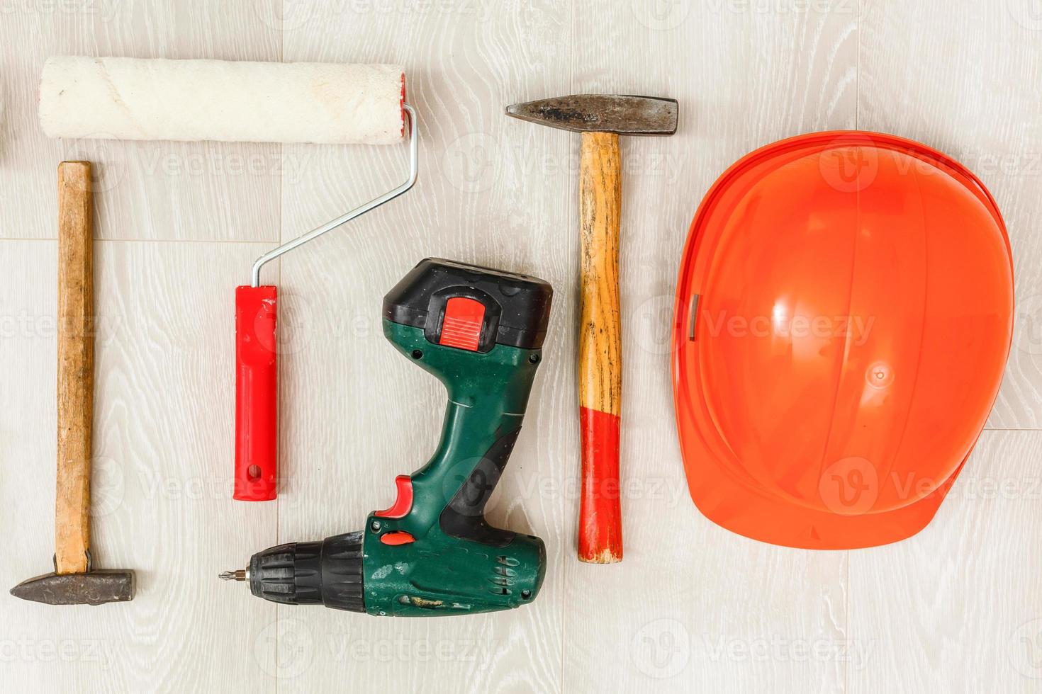 Construction safety. Protective hard hat, on wooden background, copy space, top view photo