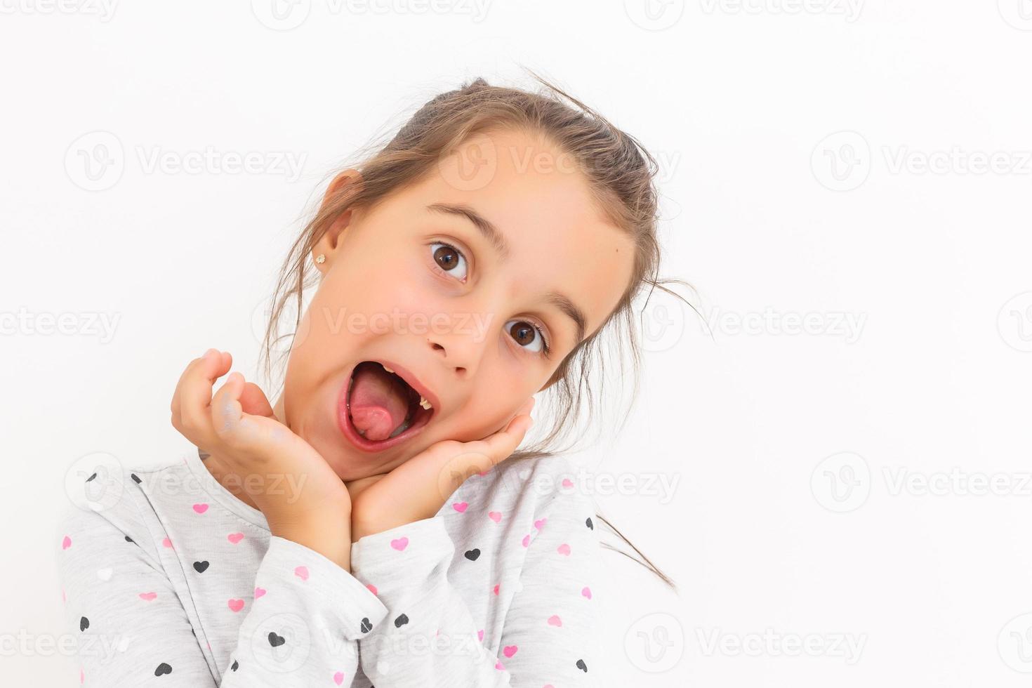 Little girl first tooth missing on a white background photo