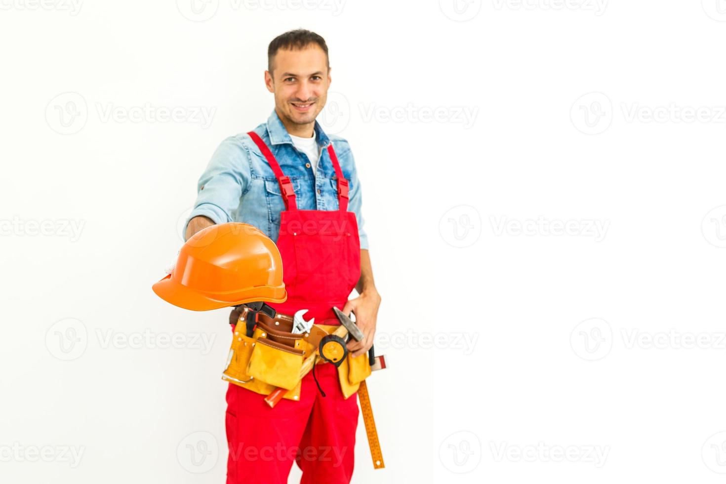 Serious Male Construction Worker with short black hair in uniform with arms folded - Isolated photo