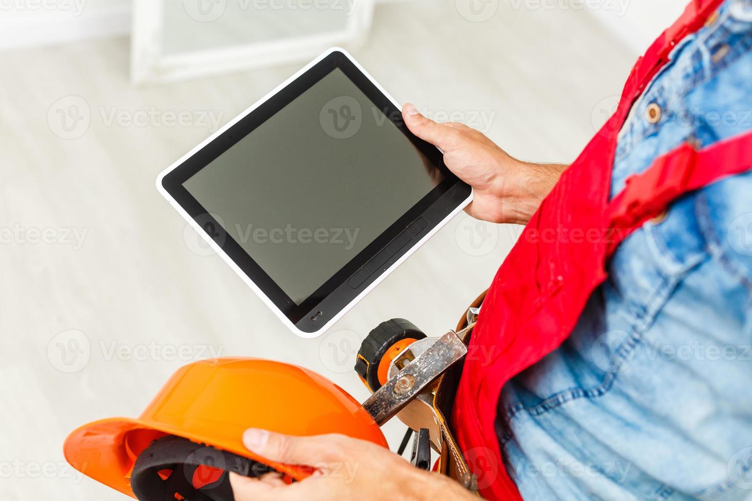 Construction manager and engineer working on building photo