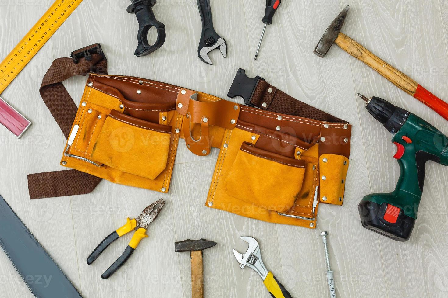 Assorted work tools on wood photo