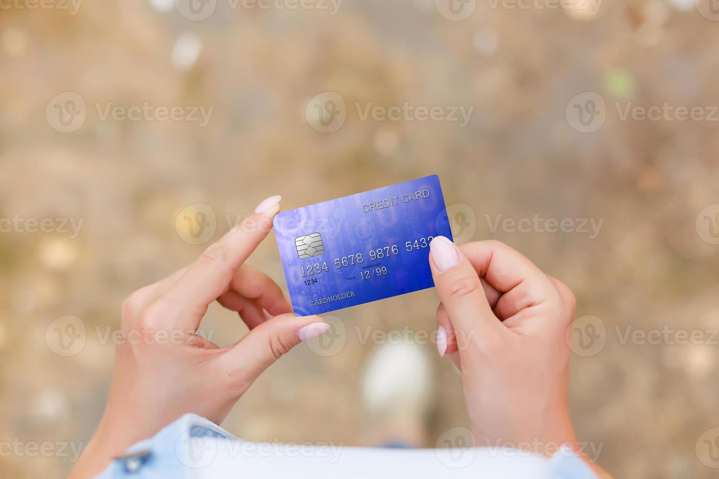 Hand holding credit card photo