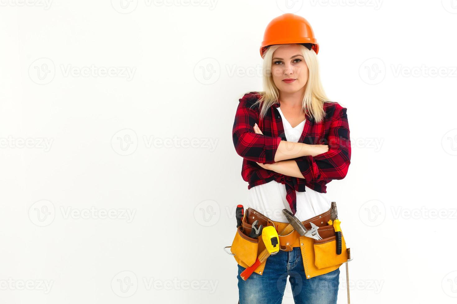 Sexy young woman construction worker photo