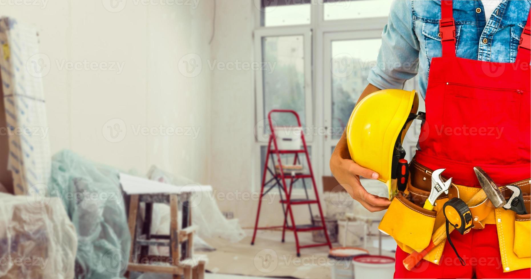 handyman with his helmet in warehouse photo