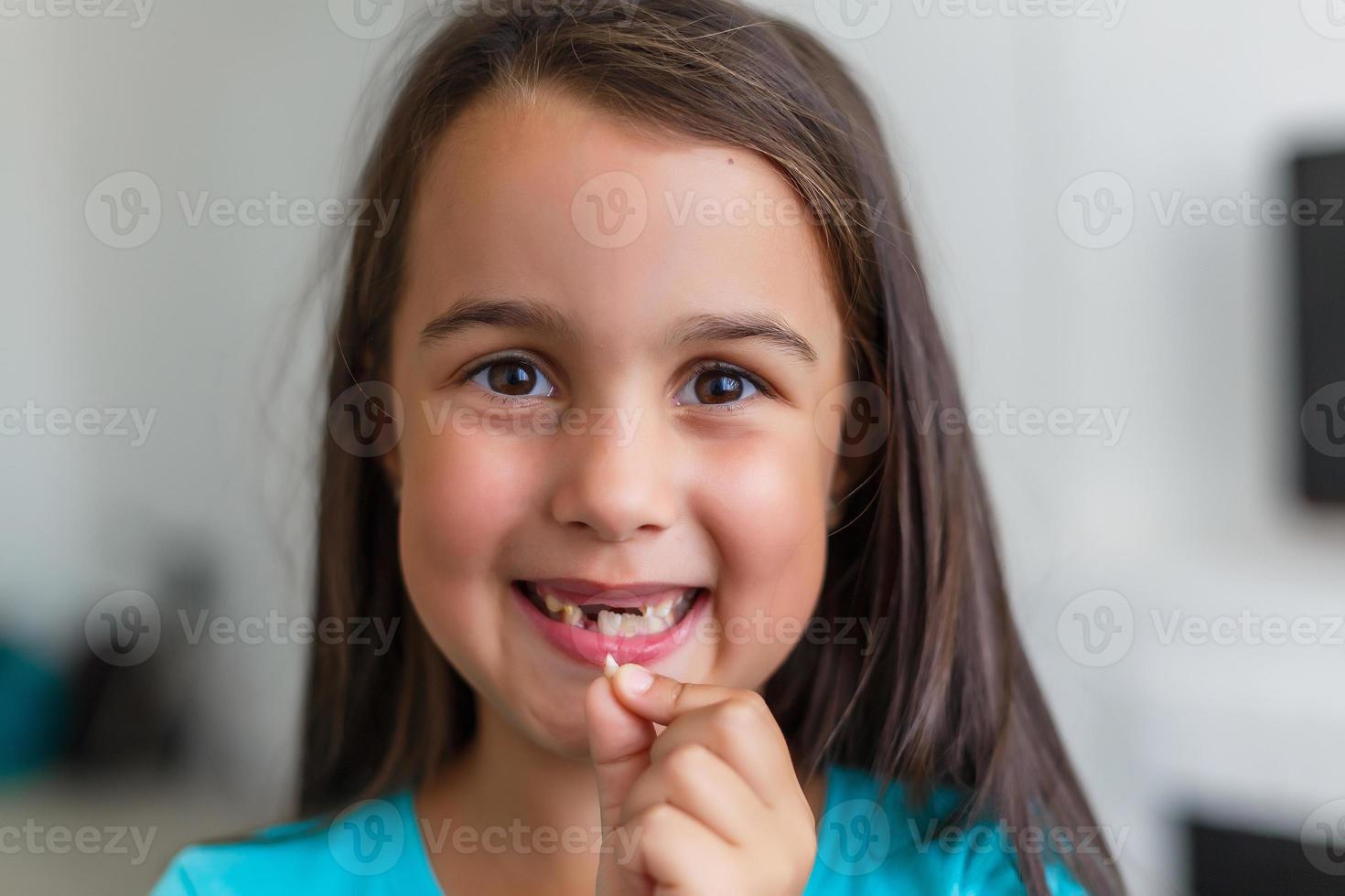 Little girl first tooth missing photo