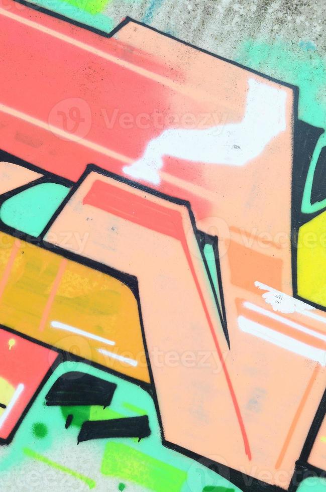 Background image with a colored graffiti pattern, which is applied to the concrete wall with aerosol paints. A lot of contours and fragments filled with paint, forming an interesting composition photo