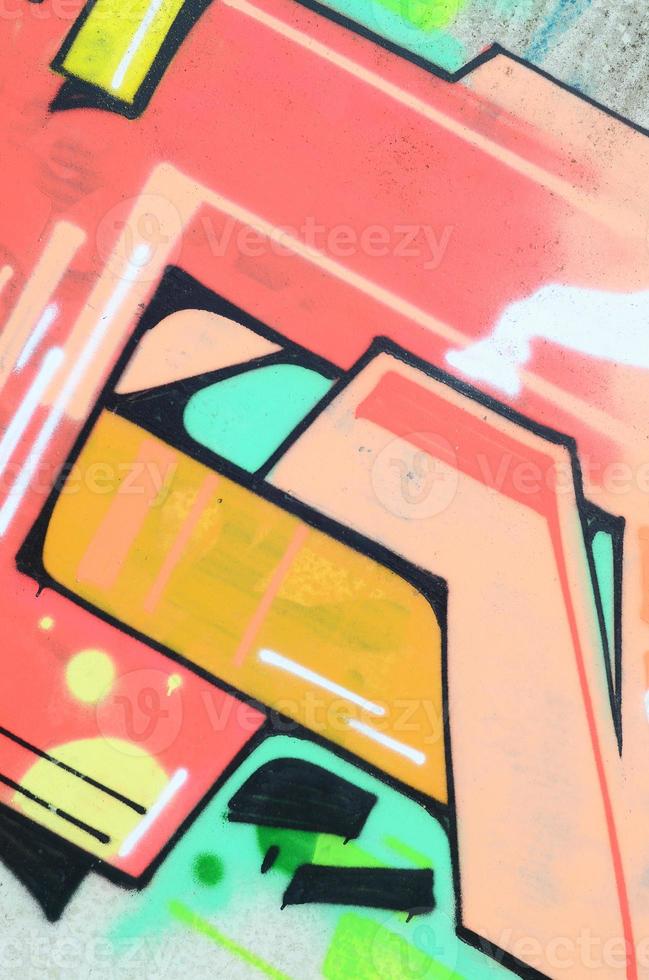 Background image with a colored graffiti pattern, which is applied to the concrete wall with aerosol paints. A lot of contours and fragments filled with paint, forming an interesting composition photo