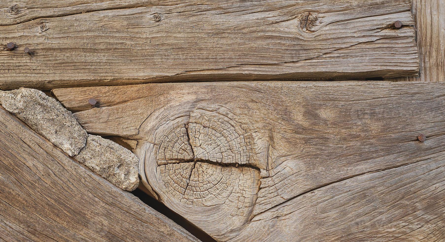 Close-up of the wooden facade of an old house, idea for a background or wallpaper photo