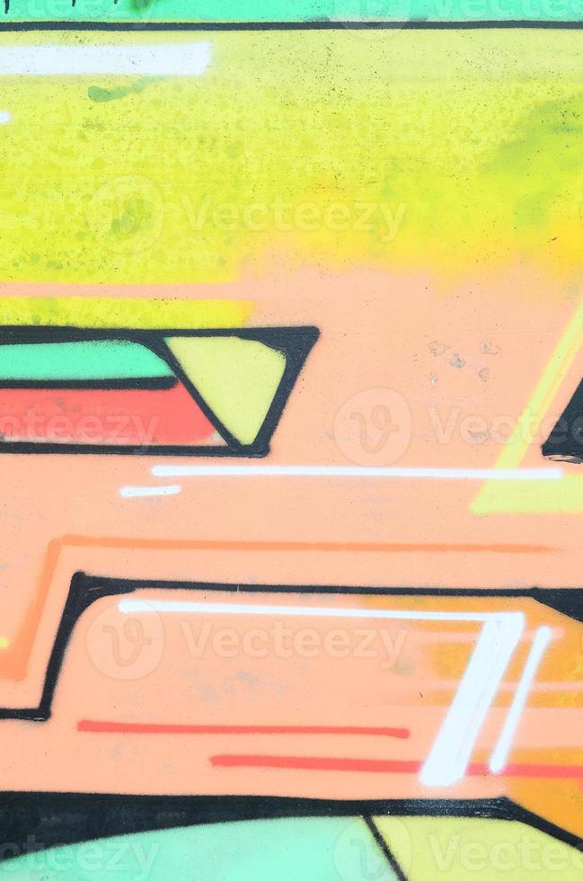 Background image with a colored graffiti pattern, which is applied to the concrete wall with aerosol paints. A lot of contours and fragments filled with paint, forming an interesting composition photo