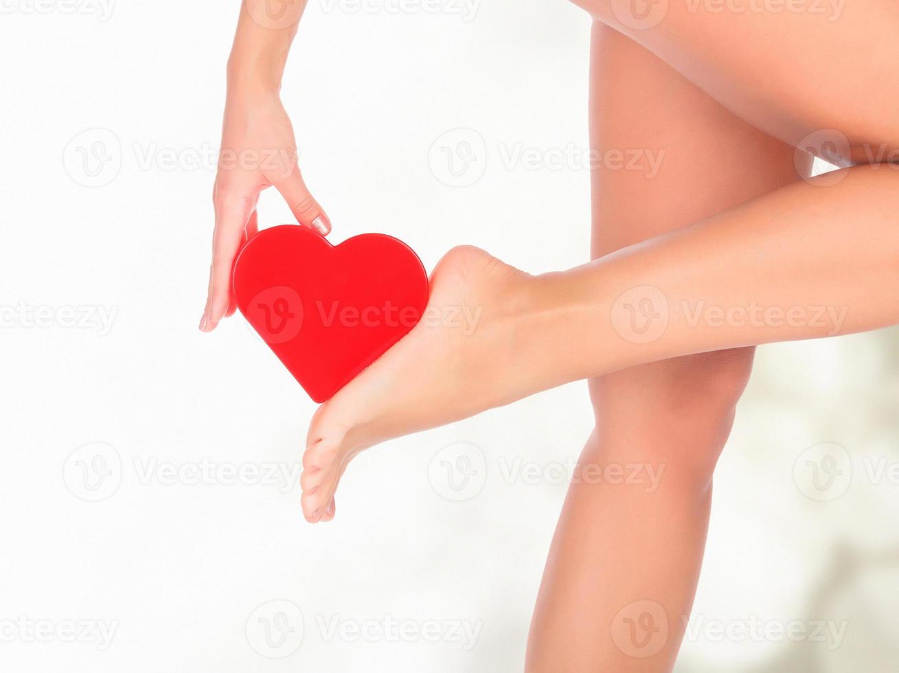 Female legs against a pastel background with blurred lights photo