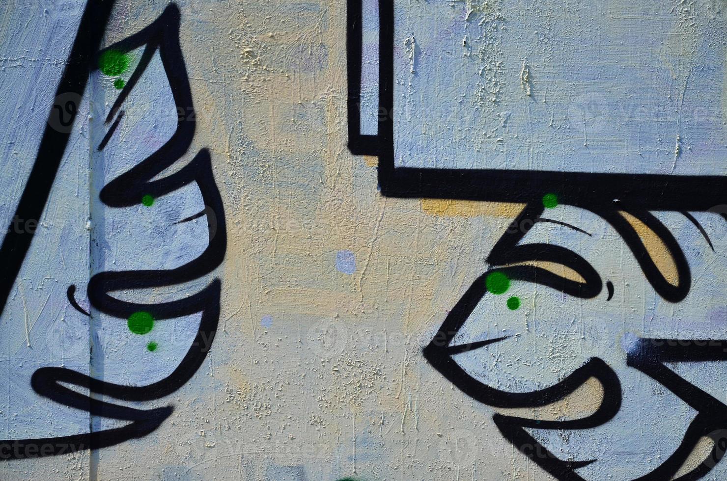 The old wall, painted in color graffiti drawing with aerosol paints. Background image on the theme of drawing graffiti and street art photo